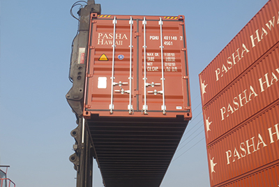 Pasha Hawaii's team loading shipping containers onto our Pasha Hawaii vessels