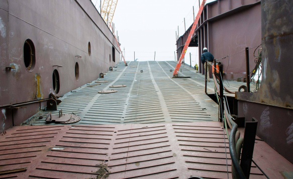 An engineer walks up the path to complete his inspections