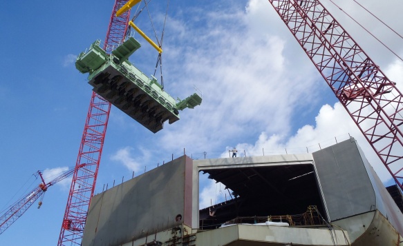 Crane lowers key parts into the Pasha Hawaii's MV Marjorie C vessel