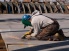 An engineer welds two parts together during construction of Pasha Hawaii's Marjorie C vessel