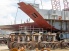 A worker works on the side panels of the Pasha Hawaii Shipping Container vessel