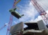 Crane lowers key parts into the Pasha Hawaii's MV Marjorie C vessel